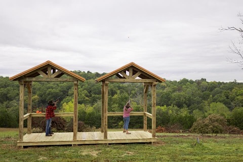 Buchanan family skeet shoots on their 100 acre property with a log home